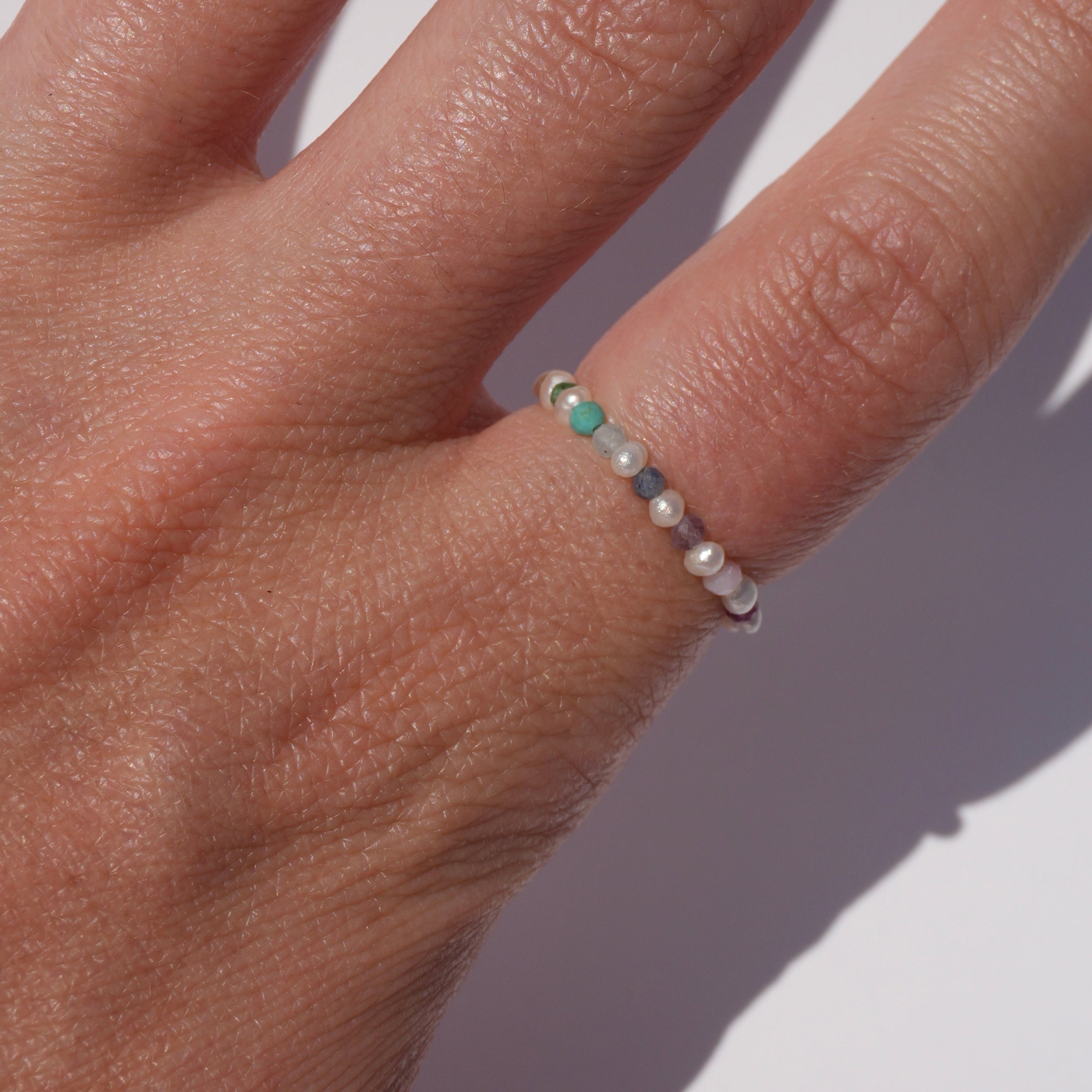 tiny pearl ring with gemstones